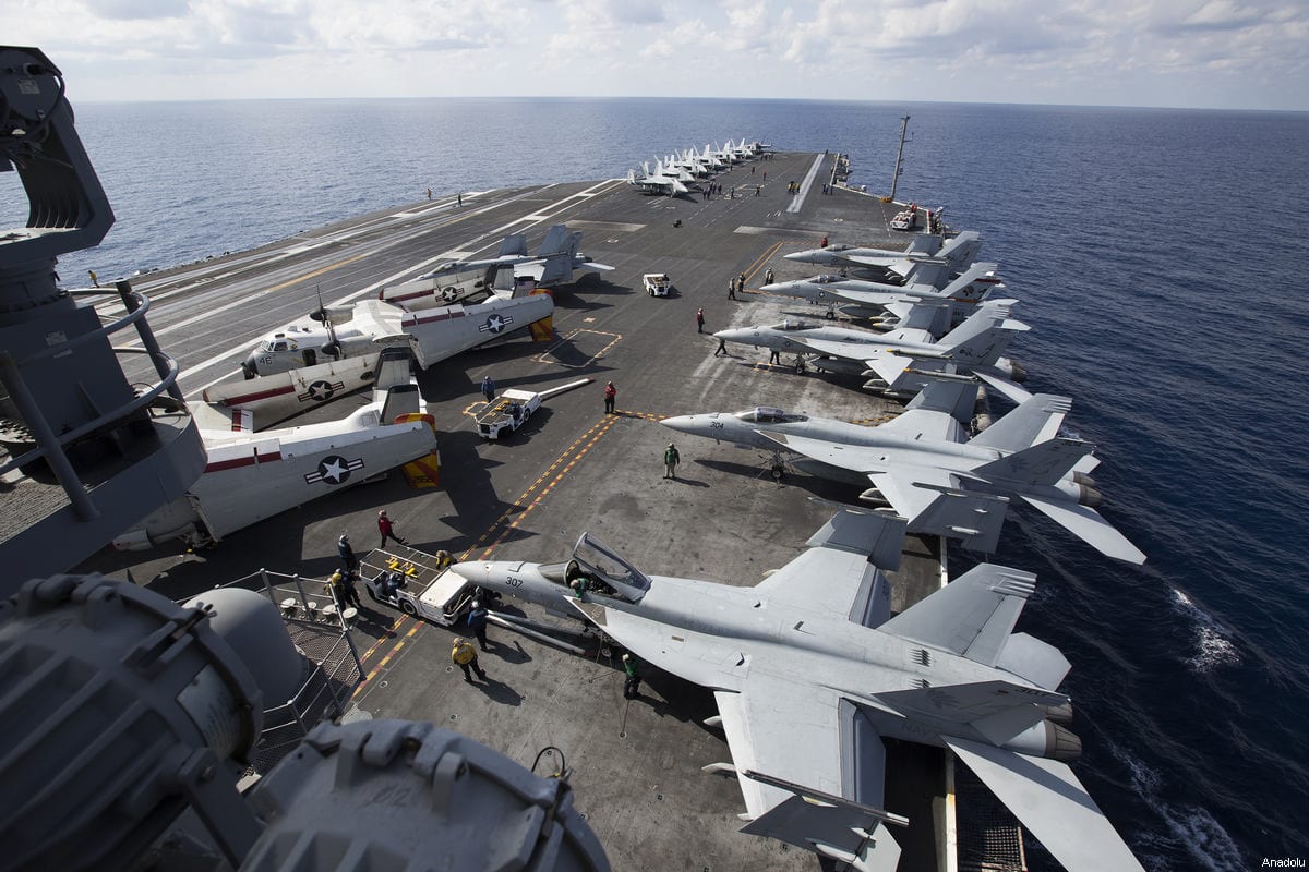F/A-18 Super Hornet and F/A-18 Hornet warplanes are seen on the flight deck of US aircraft carrier USS George Washington during its mission in the eastern Mediterranean Sea on February 21, 22017 [Murat Kaynak / Anadolu Agency]