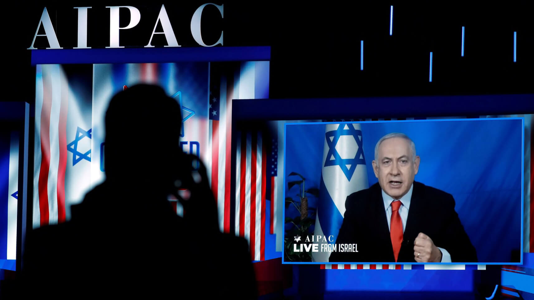 Speaking via satellite feed from Israel, Prime Minister Benjamin Netanyahu addresses the AIPAC policy conference in Washington, March 26, 2019. KEVIN LAMARQUE/ REUTERS
